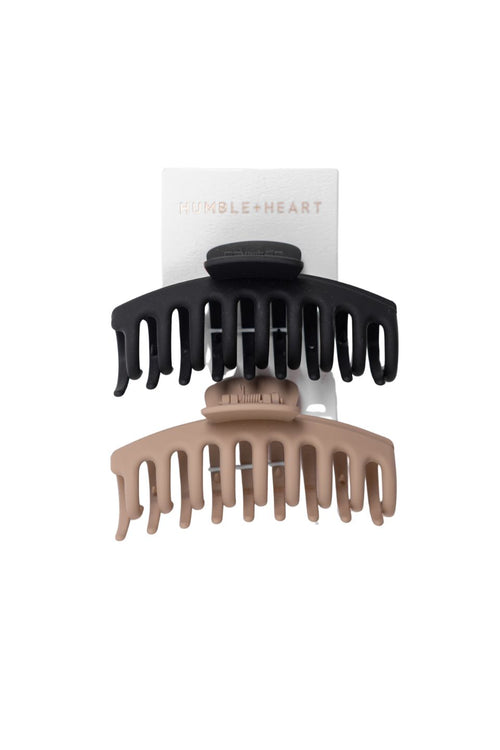 Black and beige hair clippers on a white background with 'Tumble + Heart' branding.