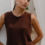 Woman wearing a brown knit top