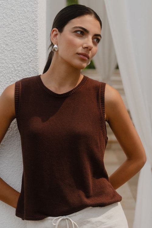 Woman wearing a brown knit top