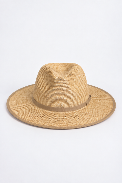 A natural straw fedora hat with a matching tan band, photographed from the side against a clean white background.