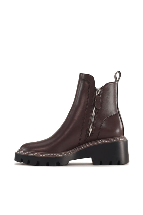 Brown leather boot with a zipper on a white background