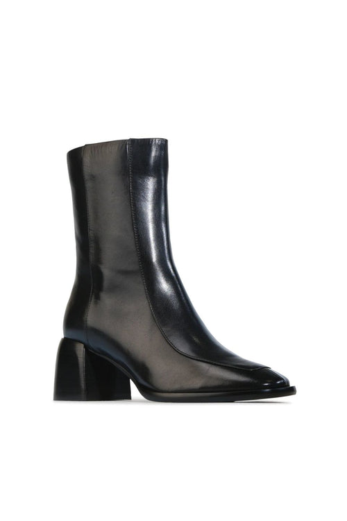 Black leather ankle boot on a white background