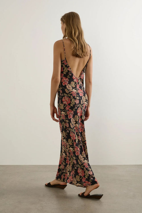 Woman wearing a floral dress with a white background