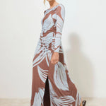 model wearing a blue and brown floral dress