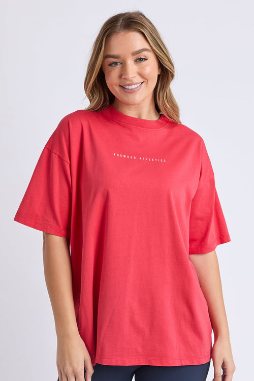 Woman wearing a red oversized tee