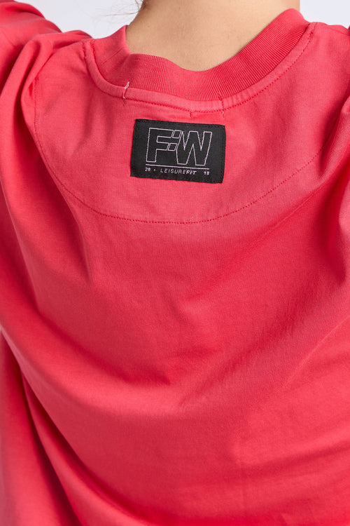 Woman wearing a red oversized tee