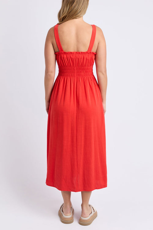 Woman wears a orange red maxi dress