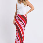 Woman wears a colourful stripe skirt