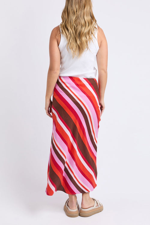 Woman wears a colourful stripe skirt