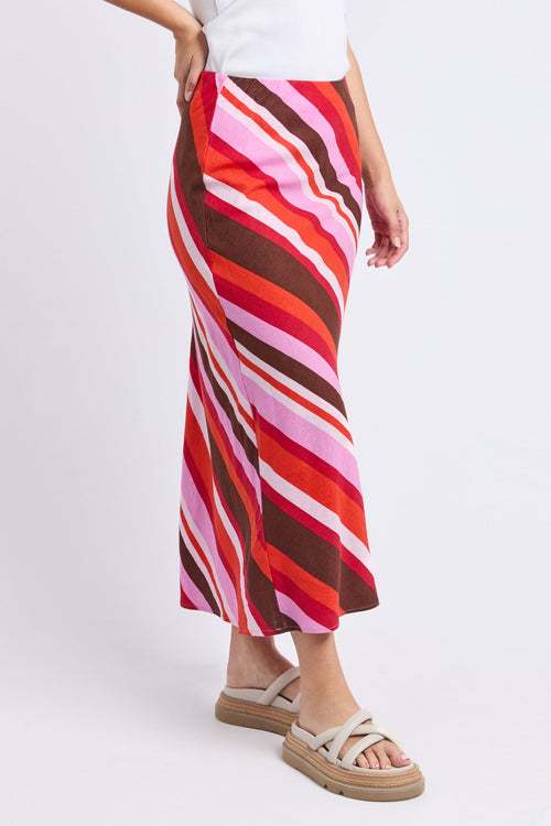 Woman wears a colourful stripe skirt