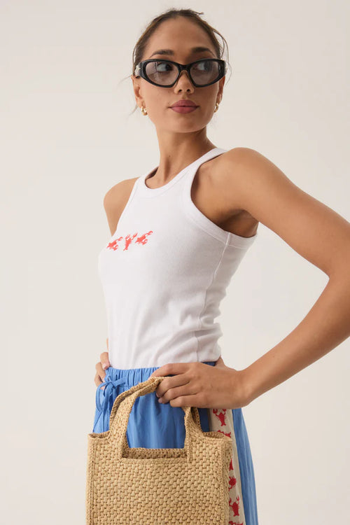 woman wearing a white tank top with a lobster print