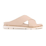 A single light beige leather slide sandal with crisscrossing straps and a low chunky sole, shown in profile against a plain white background.