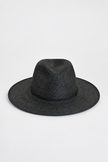 A black woven straw fedora hat with a wide brim and a matching black band, photographed against a clean white background.