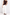 A woman modeling a dark brown off-the-shoulder knit top and white wide-leg pants against a clean white studio background.