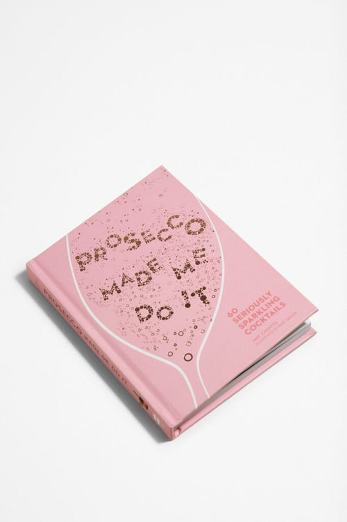 Front cover of a pink book titled 
' Prosecco Made Me Do It' by Amy Zavatto