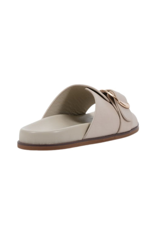 Beige sandal with a strap on a white background
