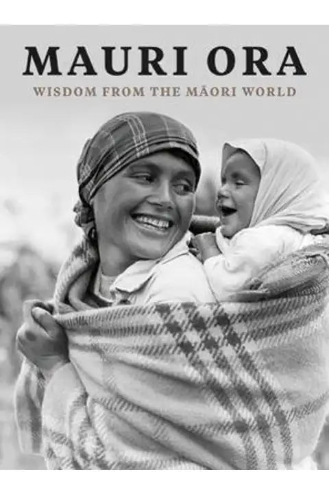 Book cover for 'Mauri Ora: Wisdom from the Móri World' featuring a black and white photograph of a smiling woman carrying a baby wrapped in a patterned blanket.
