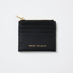 Black cardholder with 'Among the Brave' text on a white background