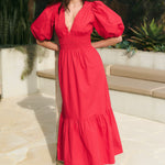Model wearing red v neck maxi dress 