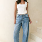 Model wearing light blue jeans 