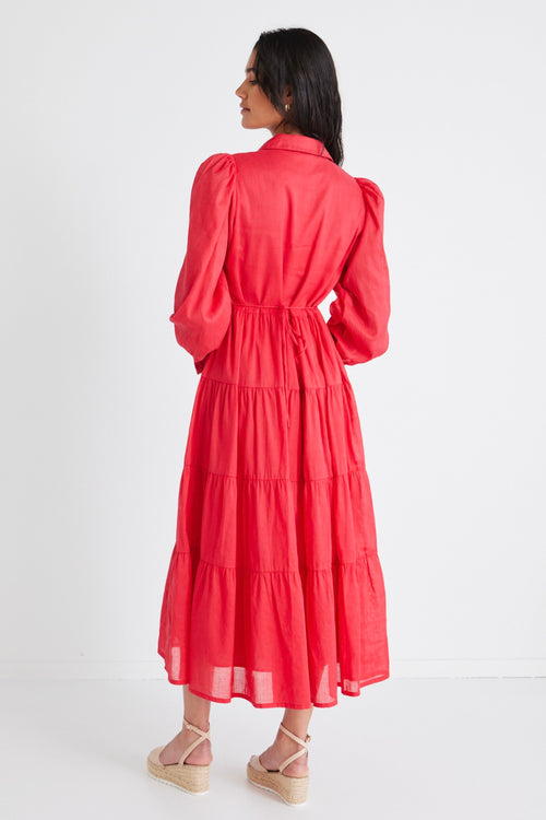 model wears a red maxi dress