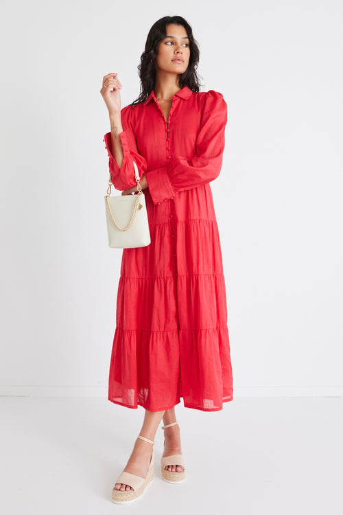 model wears a red maxi dress