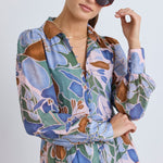 model wears a blue floral long sleeve maxi dress