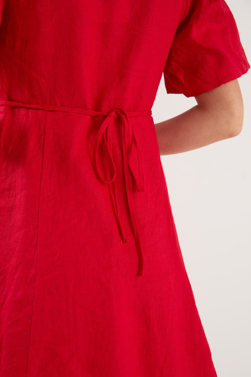 Red dress with a tie waist on a white background