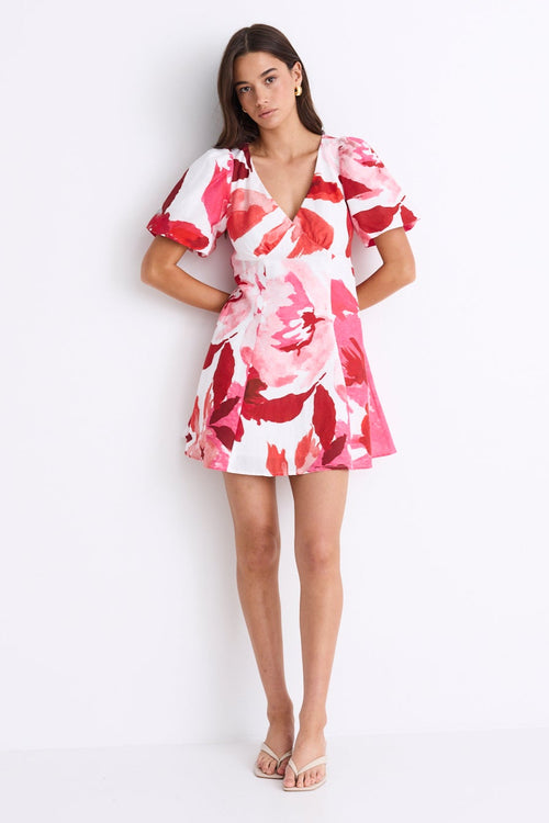 woman wearing red white pink floral mini dress