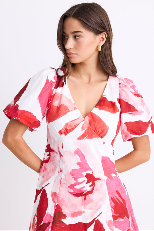 woman wearing red white pink floral mini dress