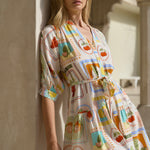 Model wearing tropical postcard print mini shirt dress 