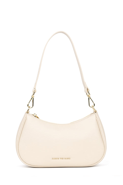 A cream-colored faux leather crescent-shaped shoulder bag with gold hardware and a small gold logo on the front, displayed on a clean white background.