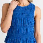 model wears blue cotton top