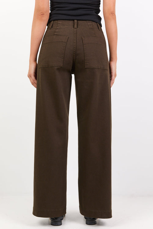 Brown wide-leg pants worn by a person on a white background