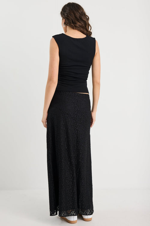 Woman wearing a black dress on a white background