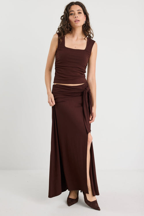 woman wearing a brown ruched set 