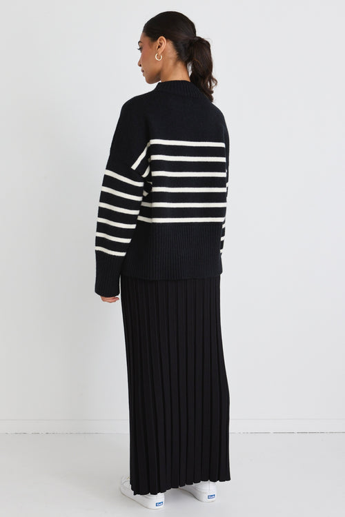 model wears a black stripe knit