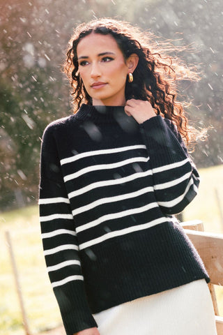 model wears a black stripe knit
