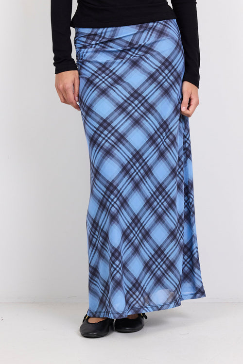 Person wearing a blue plaid skirt on a white background