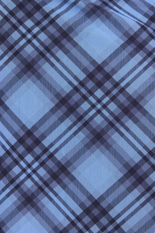 Close-up of blue and black plaid fabric texture