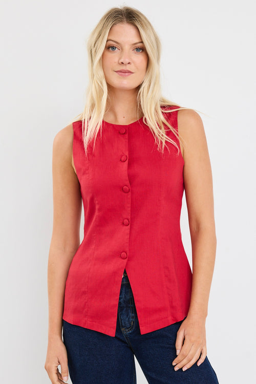 model wears a red linen vest with dark jeans