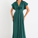 Woman wearing a green dress on a white background