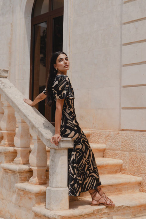 model wears a black beige patten maxi dress