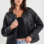 Woman wearing a black quilted jacket