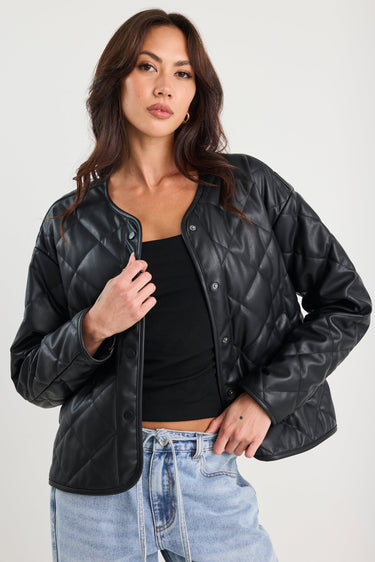Woman wearing a black quilted jacket
