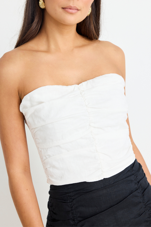 model wears White Linen Strapless Top