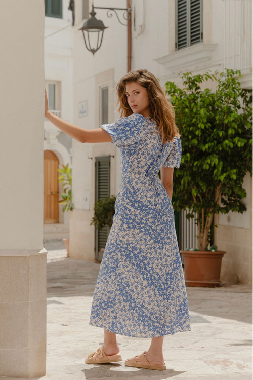 model wears a Blue Floral Puff Sleeve Bias Maxi Dress