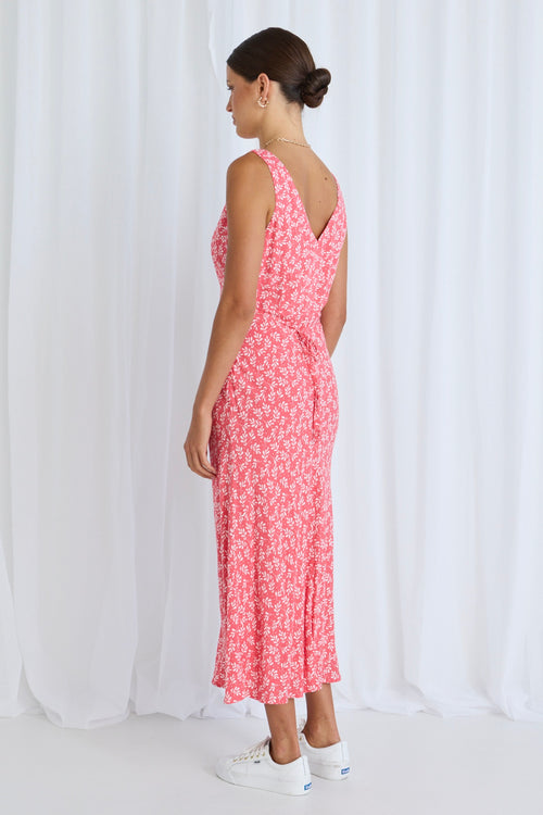 Model wears a pink floral dress