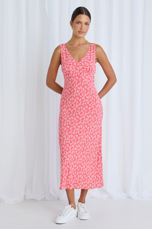 Model wears a pink floral dress