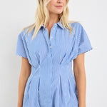 model wears a blue stripe corset blouse with blue jeans